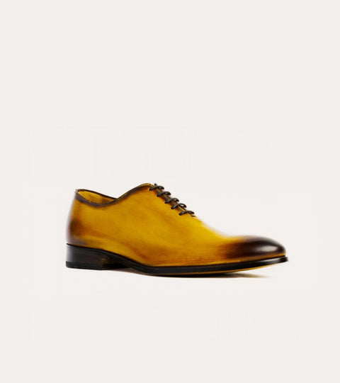 Golden brown men's Italian leather wholecut lace-up dress shoe.