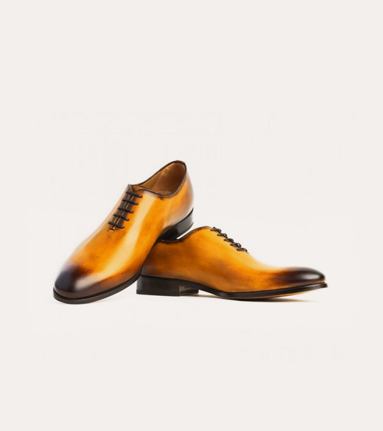 Golden brown men's Italian leather wholecut lace-up dress shoe.