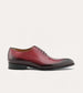 Men's brown Italian leather wholecut lace-up dress shoes.