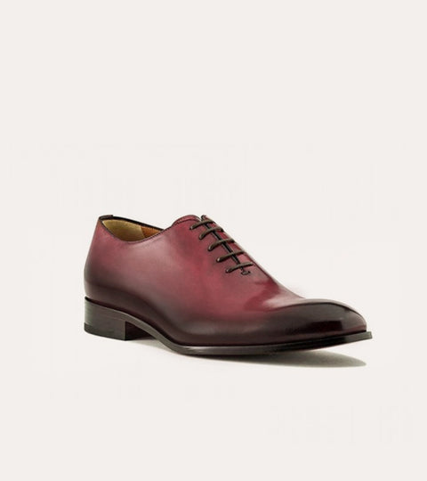 Men's brown Italian leather wholecut lace-up dress shoes.