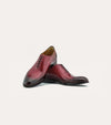 Men's brown Italian leather wholecut lace-up dress shoes.