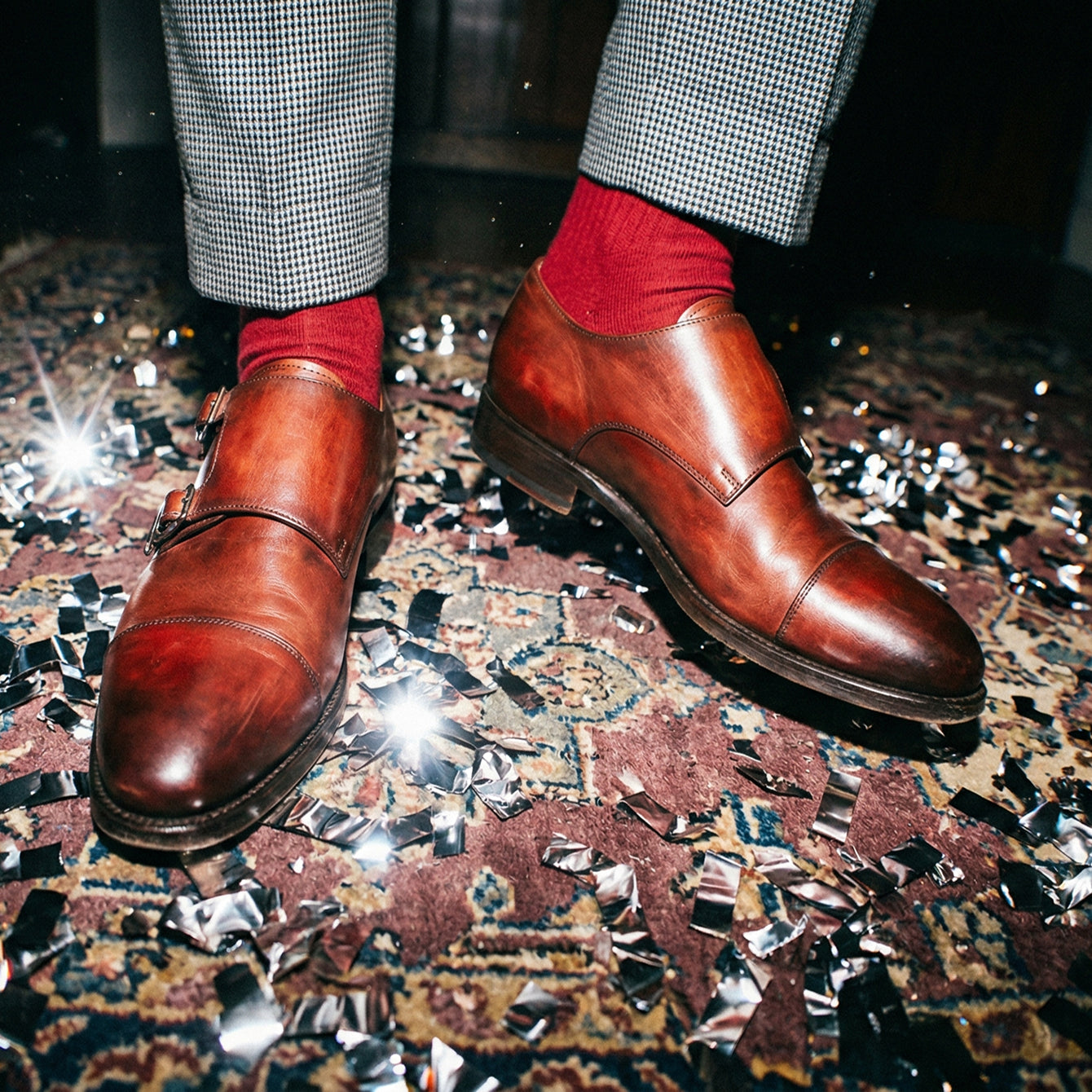 Close-up of man standing at party wearing men's brown Italian leather monkstrap dress shoes