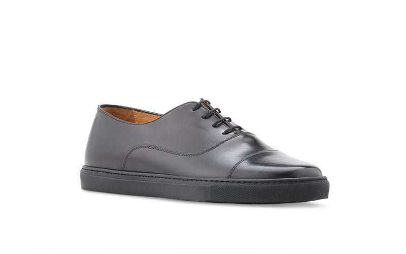 black learher dress sneaker with black outsole